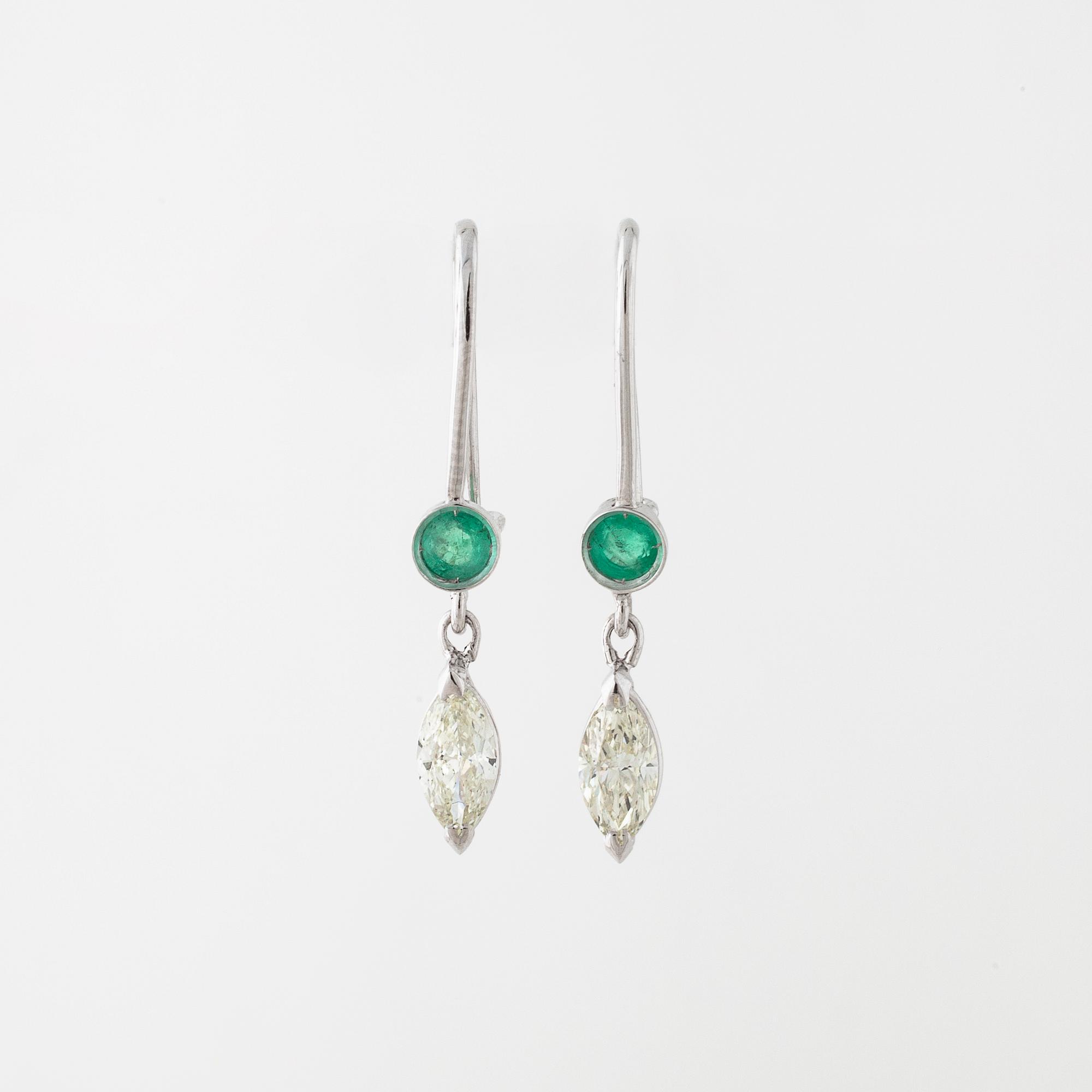 A pair of emerald and marquise cut diamond earrings.