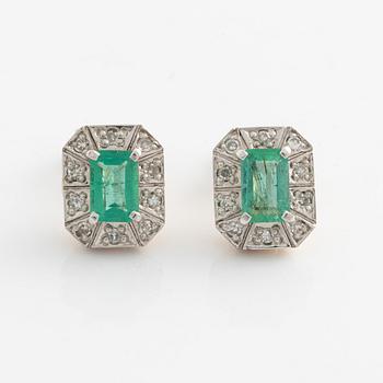 Earrings with emeralds and brilliant-cut diamonds.