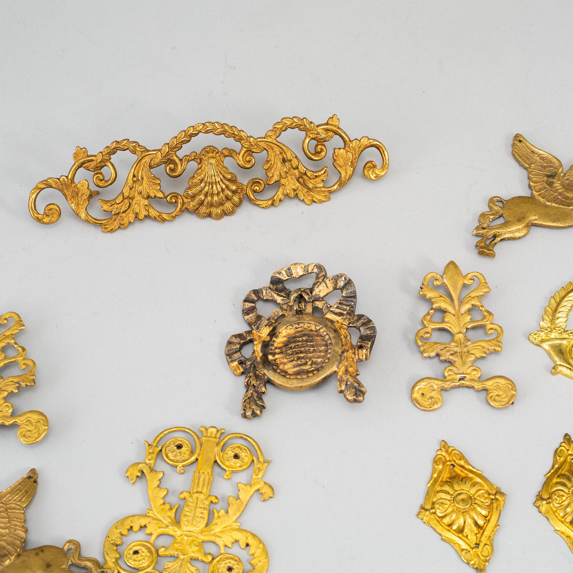 Furniture mountings, 17 parts, brass, 19th-20th century.