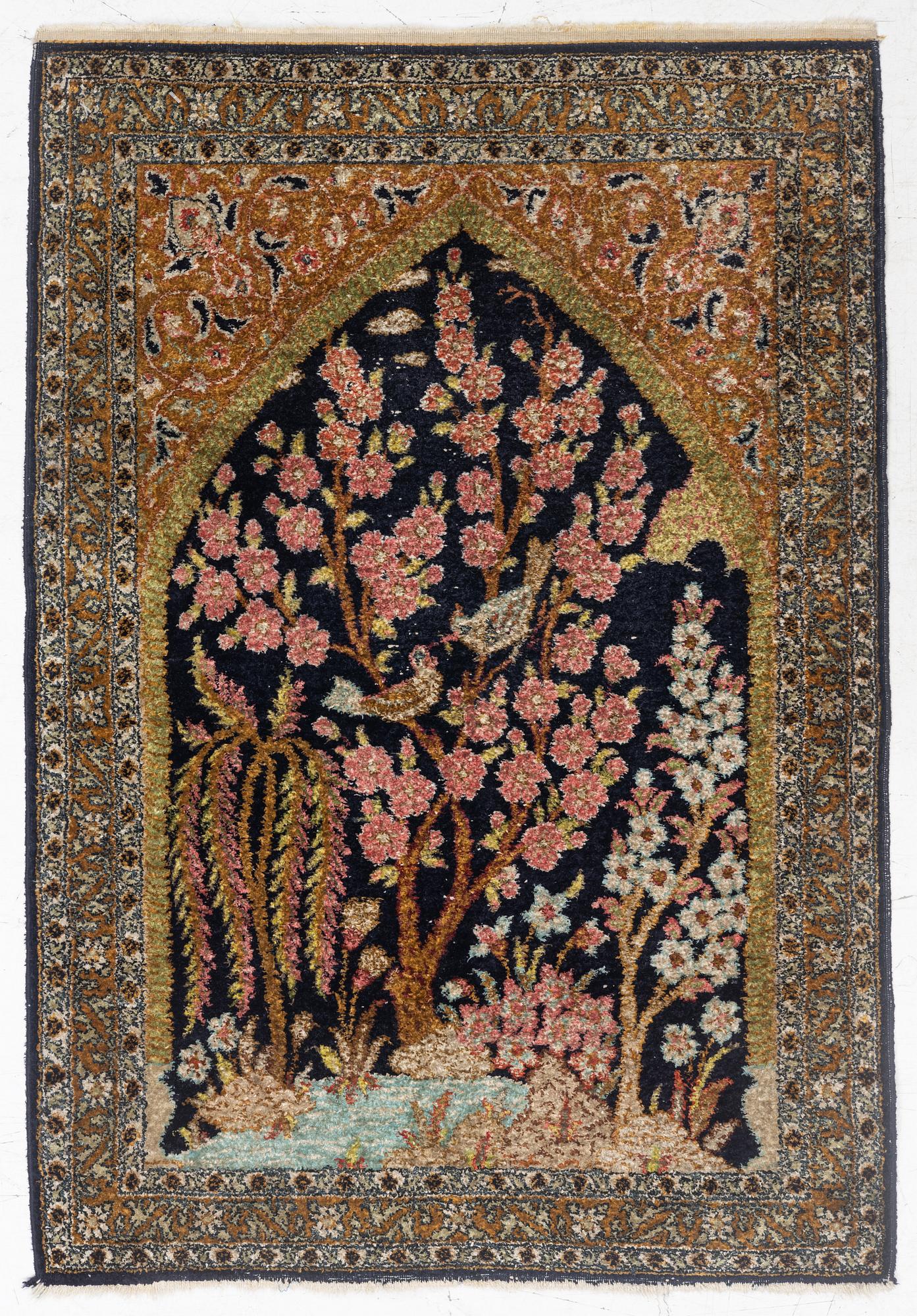 A semi-antique silk Ghom rug, central Iran, c. 32 x 23 in.