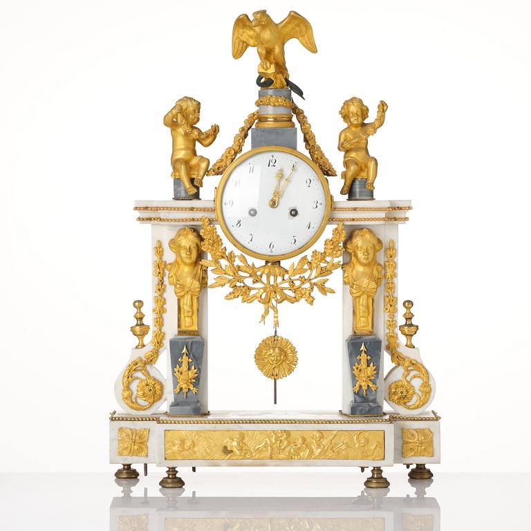 A French Louis XVI ormolu and marble portico mantel clock, late 18th century.
