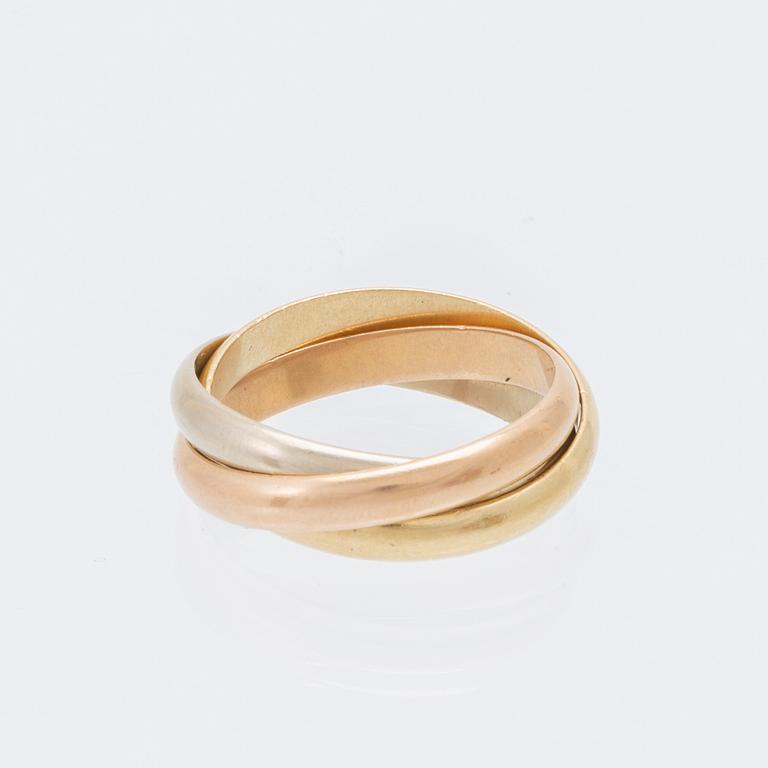 An 18K tri-coloured "Trinity" gold ring by Cartier.