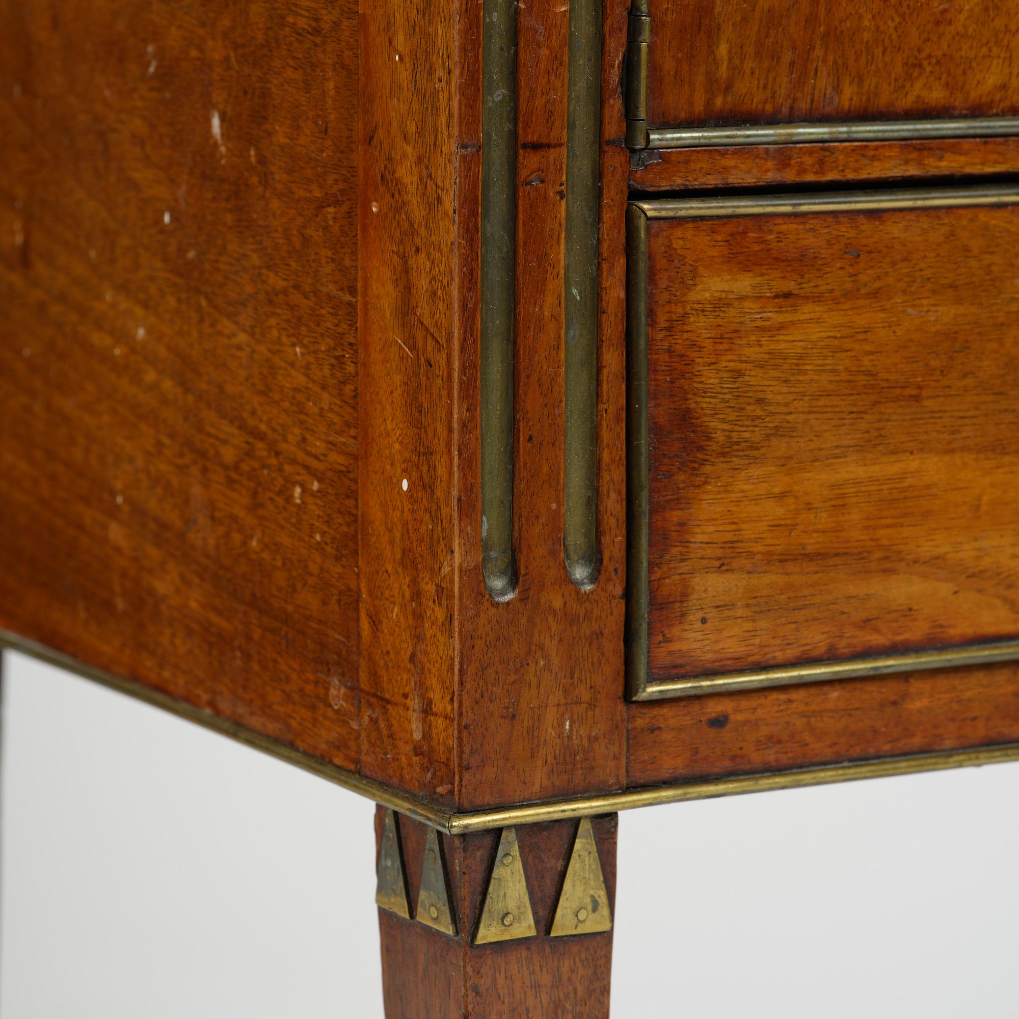 A late Gustavian mahogany chamberpot cupboard, circa 1800.
