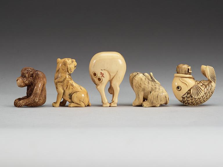 A set of eight Japanese ivory and bone Netsukes, Meiji period.