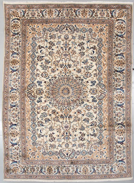 A Nain rug, part silk, 348 x 239 cm.