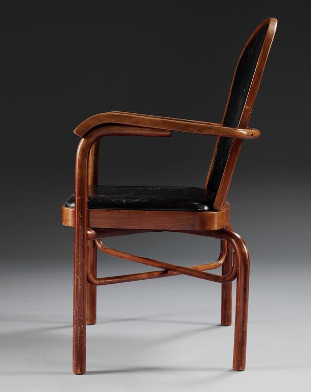 A Sigurd Lewerentz stained beech and black leather chair.