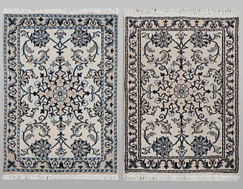 A pair of rugs, Nain, part silk, ca 80 x 60 cm 
 & ca 83 x 58 cm.