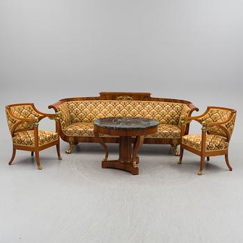 A circa 1900 sofa, two easy chairs and a table.