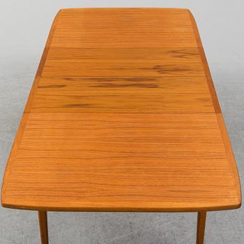 A second half of the 20th century teak veneered dining table.