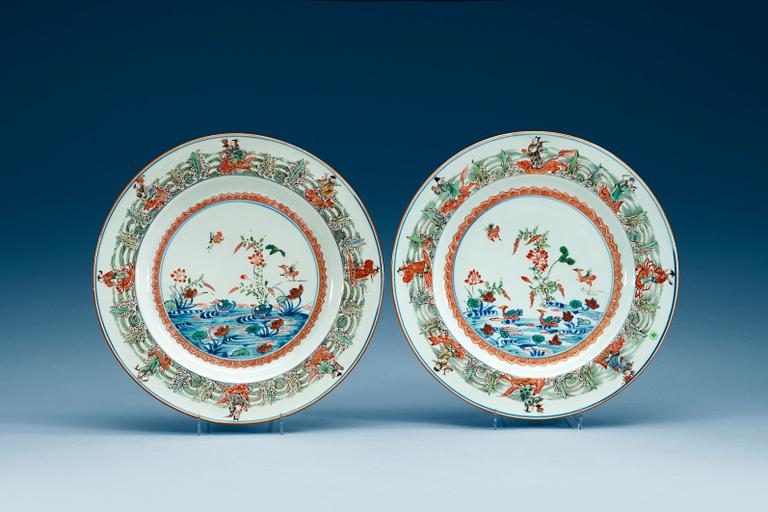 A pair of famille-verte chargers, Qing dynasty, Qianlong (1736-95).