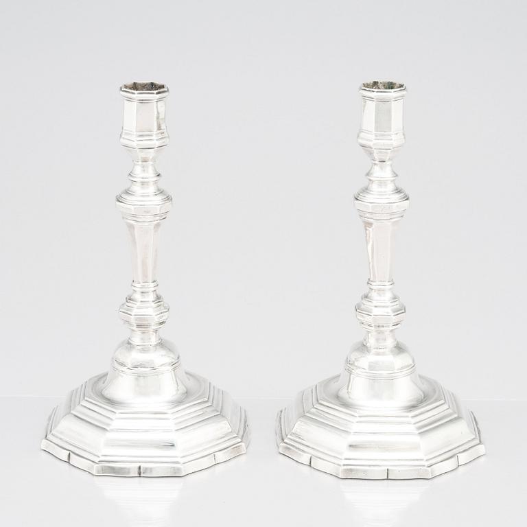A pair of French silver candlesticks. Marks of Antoine Bailly. With charge and decharge marks for Paris 1750-1756.