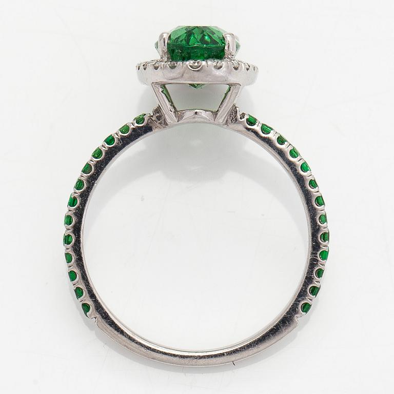 A 14K white gold ring, with tsavorite garnets and diamonds.