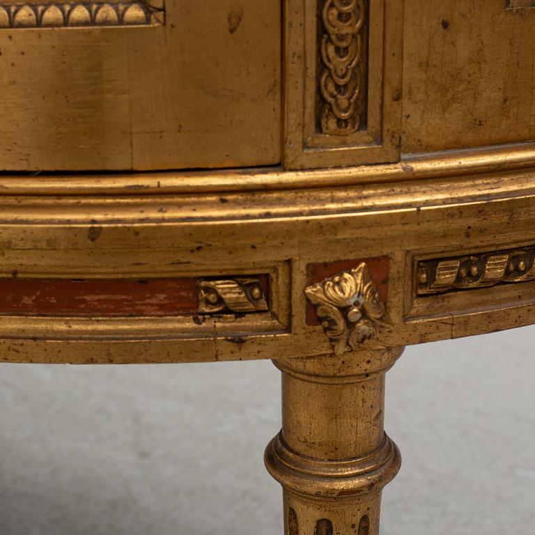 A Louis XVI-style display cabinet, circa 1900.