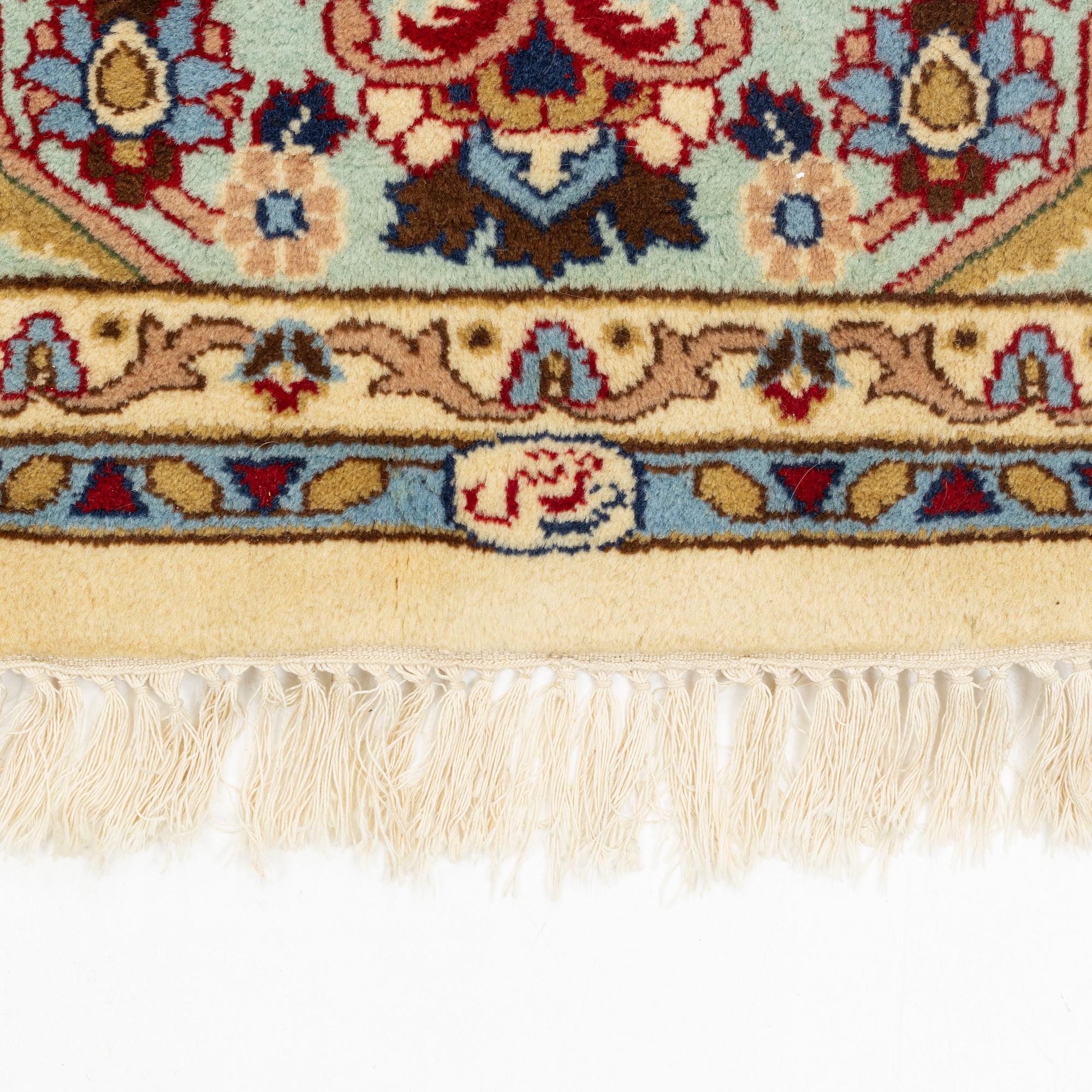 A carpet, signed, circa 286 x 212 cm.