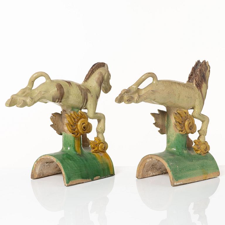 A set of two green and yellow glazed roof tiles figures of flying horses, Qing dynasty.