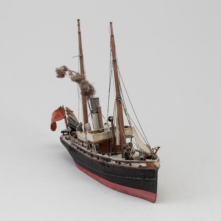 A 20th century wooden model of a steam engine boat.