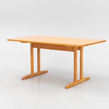 A beech dining table, second half of the 20th Century.