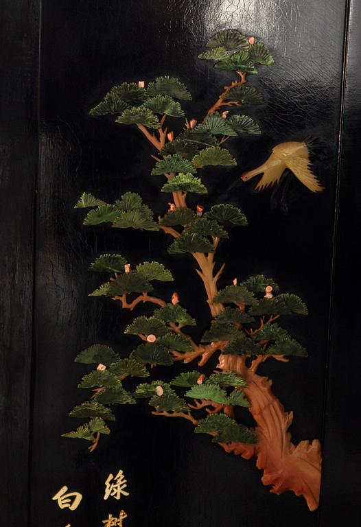 A Japanese 20th century lacquered folding screen with stonework,