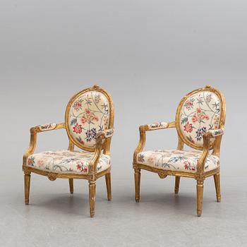 Two matched Gustavian late 18th century armchairs.