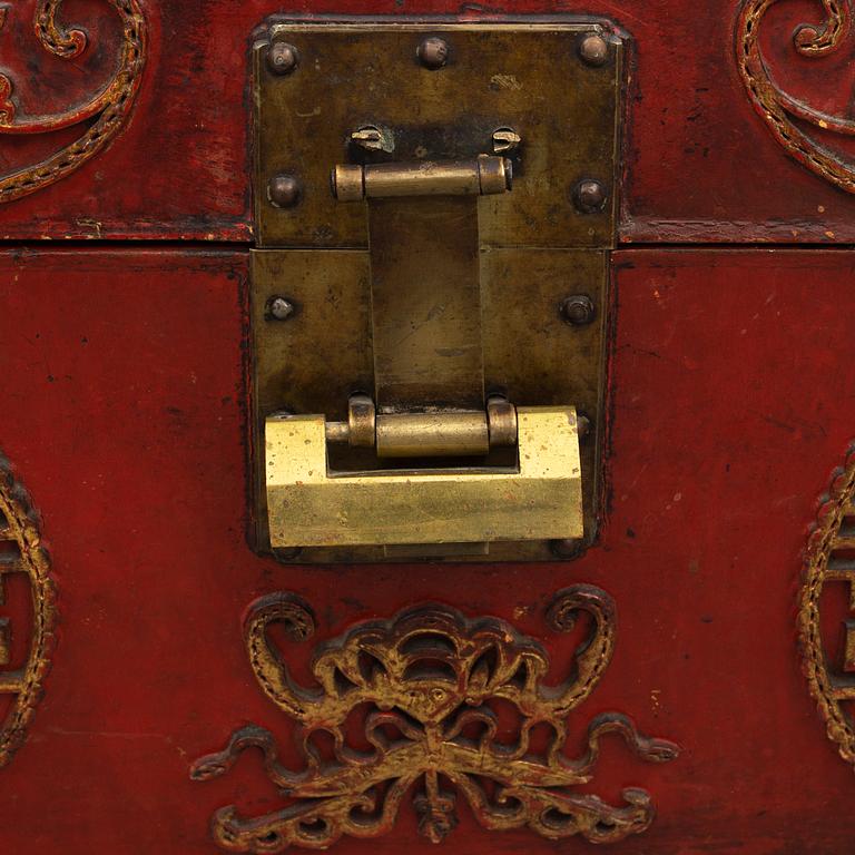 A Chinese red leather and wooden box, 20th century.