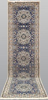 A runner carpet, Nain part silk, 380 x 100 cm.