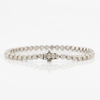 Tennis bracelet 18K white gold with brilliant-cut diamonds.