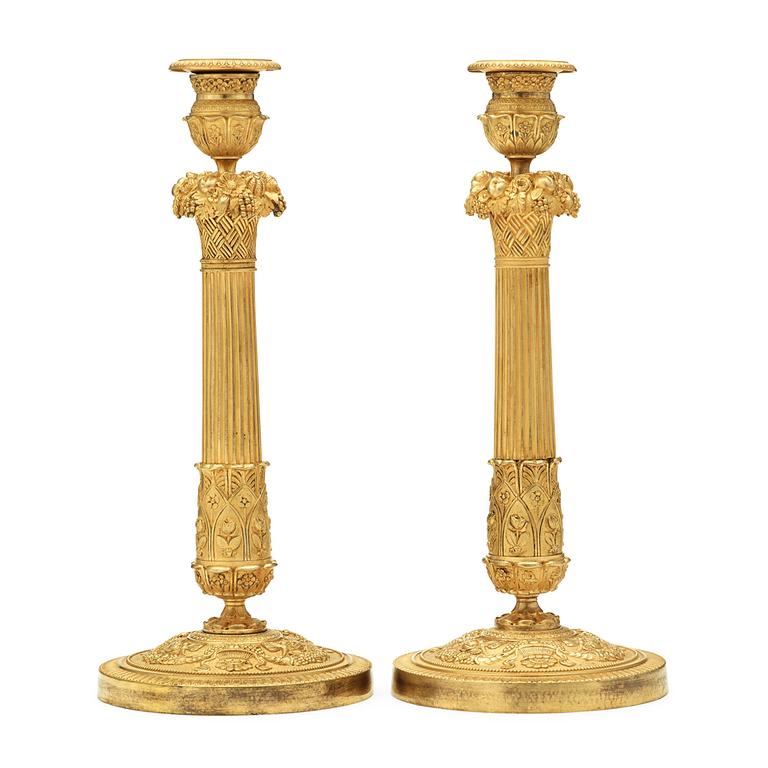 A pair of French mid 19th century candlesticks.