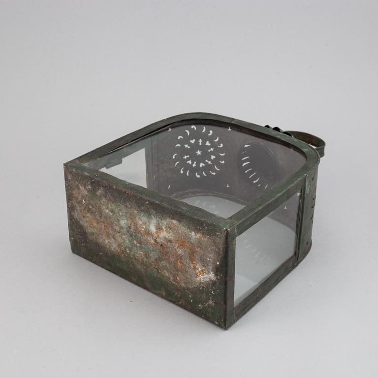 An 18th century tinplate and glass lantern.