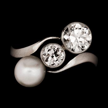 An old cut diamond and possibly natural blister pearl ring. Diamonds total carat weight circa 0.90ct.