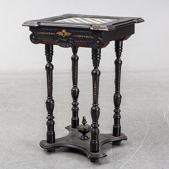 A porcelain and wooden mounted chess table, late 19th century.