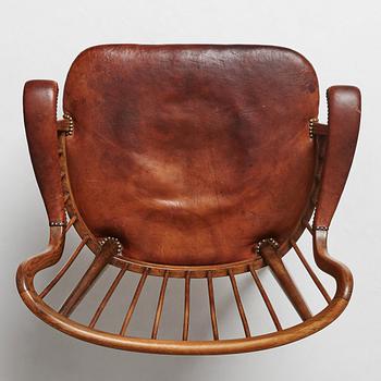 Otto Schulz, a Swedish Modern stained beech and cognac coloured leather armchair.