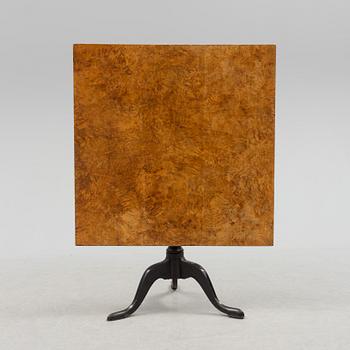 A 19th century folding table with root veneer.
