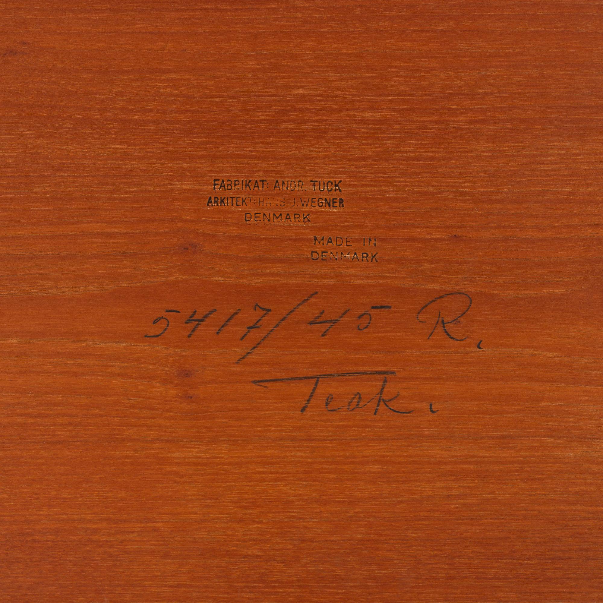 A mid 20th century teak serving trolley by Hans J Wegner, Andr. Tuck, Denmark.