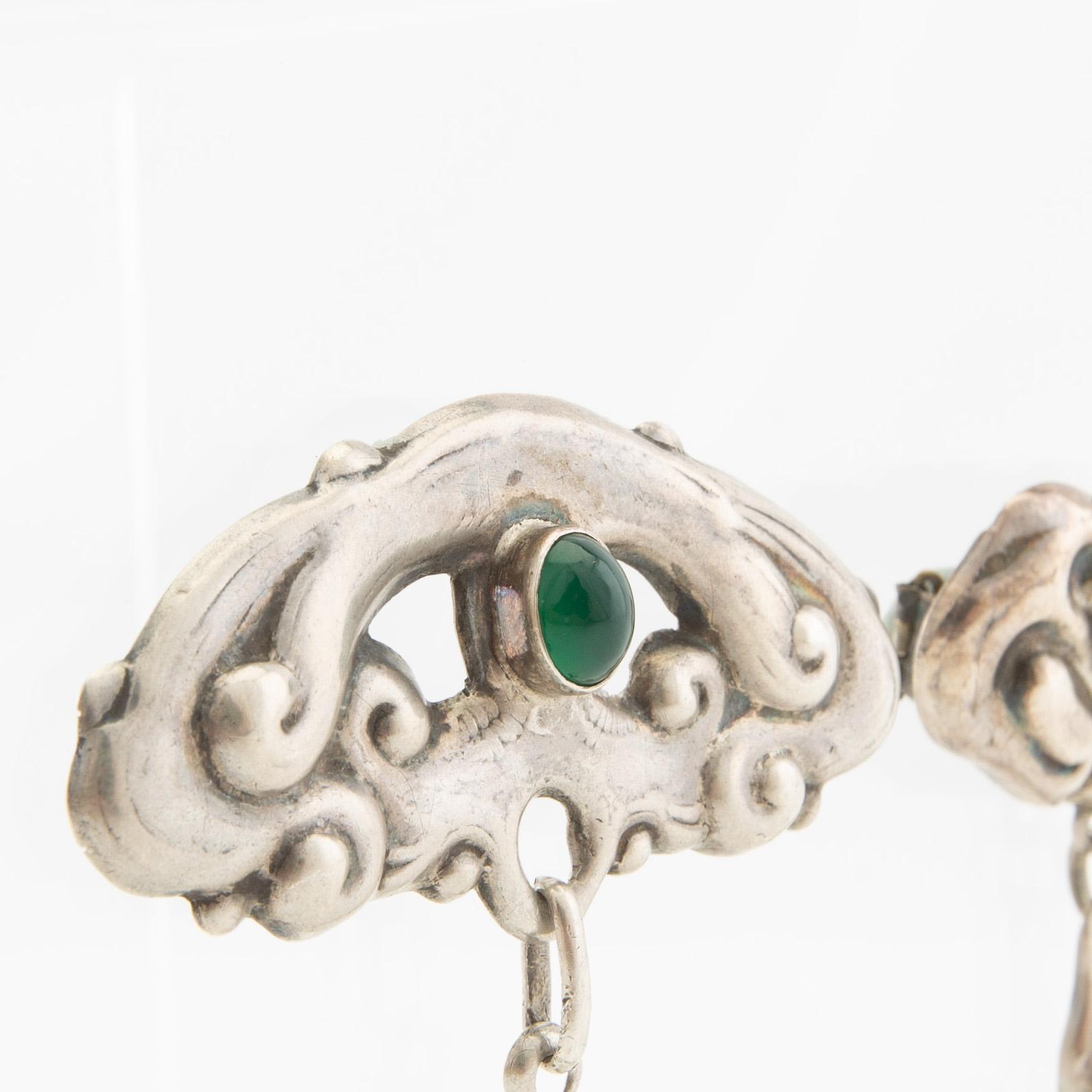 Brooches, 2 pieces, Art Nouveau, early 20th century, pewter, moonstone, and green stone.