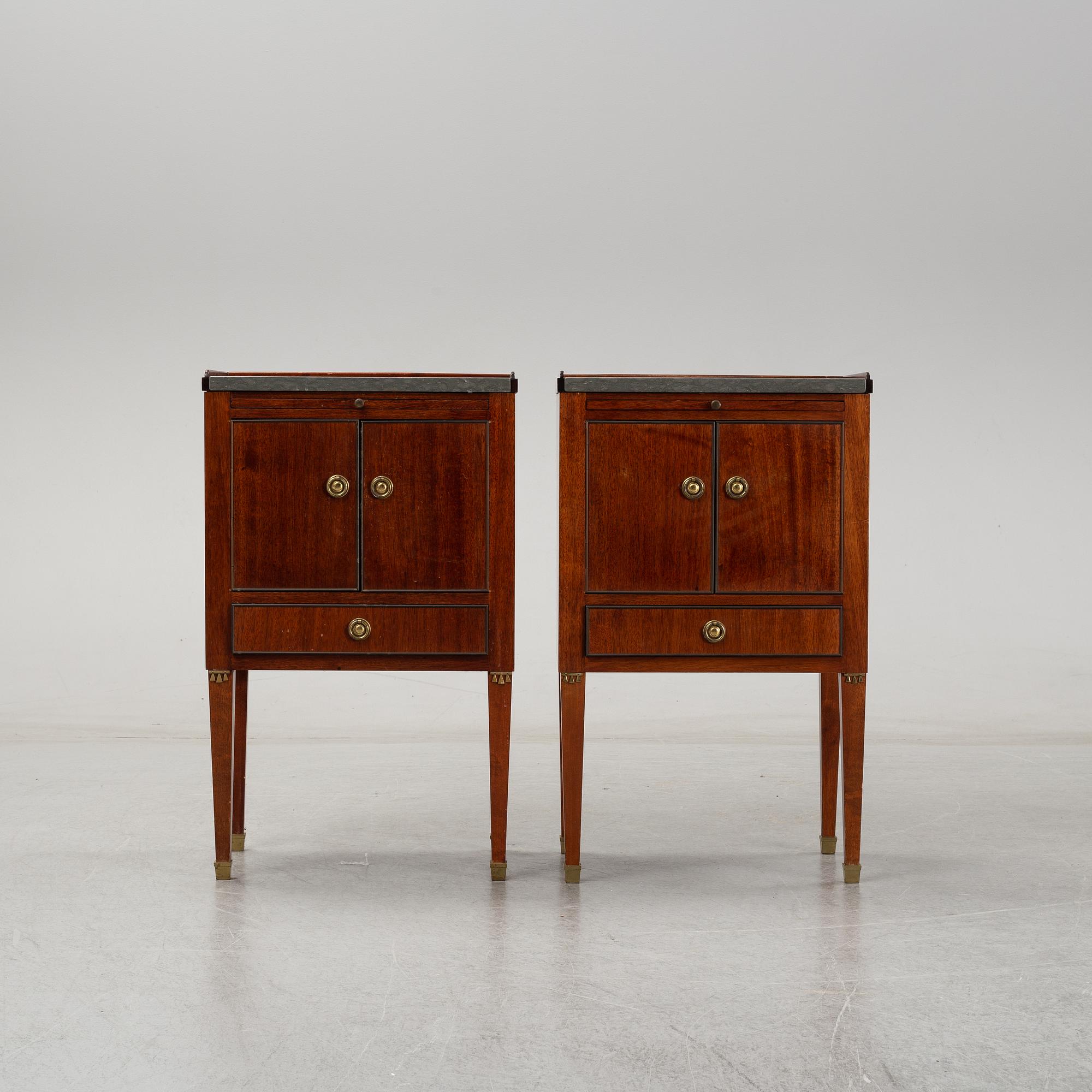 A pair of mahgany veneered bedside cabinets, early 20th Century.
