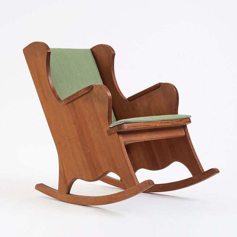 Nordiska Kompaniet, a Swedish Modern stained pine 'Lovö' rocking chair, 1940s.