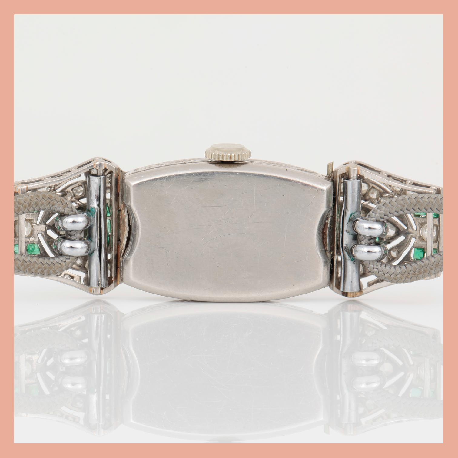 ARMBANDSUR, Art Deco, silver med åttkantslipade diamanter, tot ca 0,74 ct och smaragder. Total vikt ca 15 g.