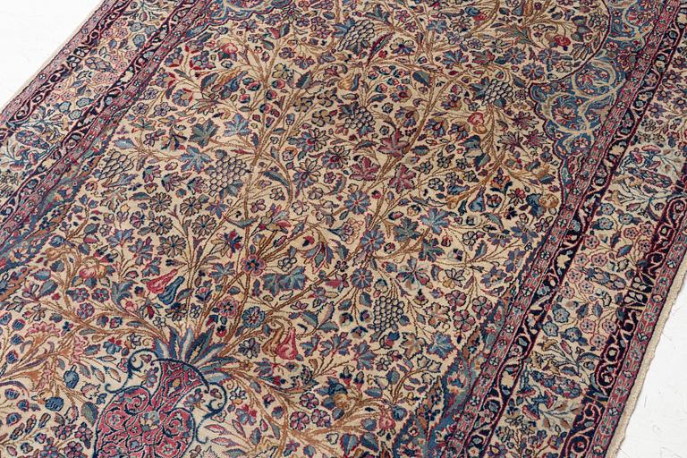 A semi antique Kirman rug, South Persia, c. 228 x 136 cm.