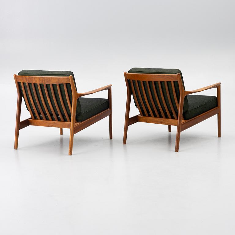 Folke Ohlsson, a pair of 'USA 75' armchairs, Dux, Sweden, 1960's.