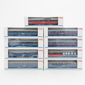 Märklin, an electrical locomotive and 9 passenger cars, gauge H0, i boxes.
