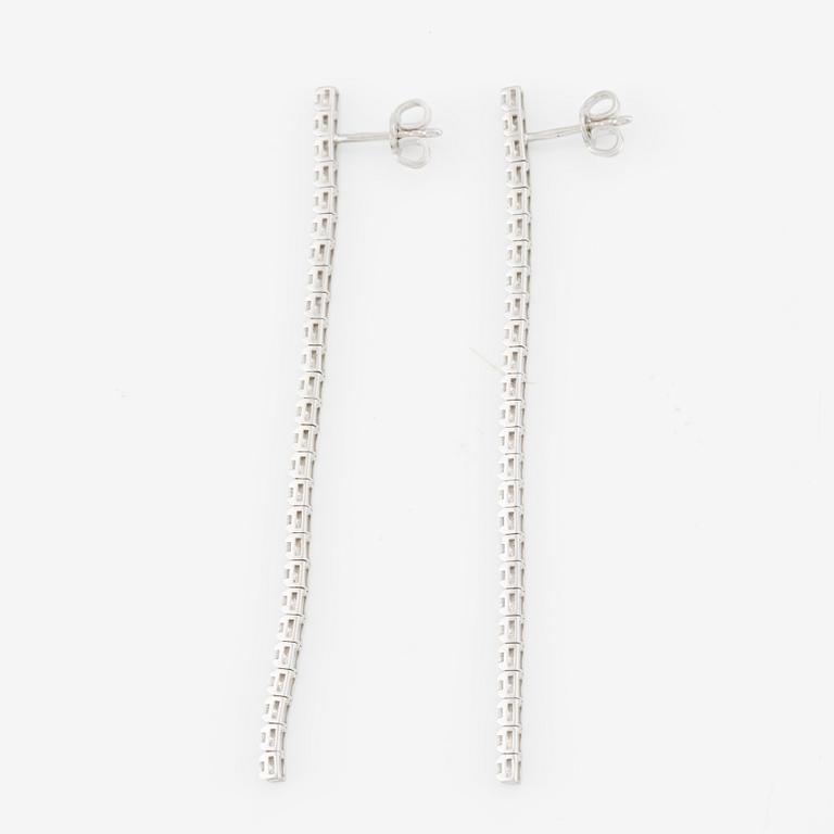 Brilliant-cut diamond line earrings.