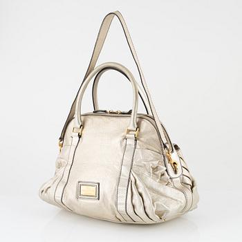 Valentino Garavani, A metallic leather bag.