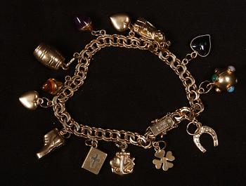 ARMBAND, 18 K guld samt halvädelstenar, Köping, 1967. Ca 22 g.