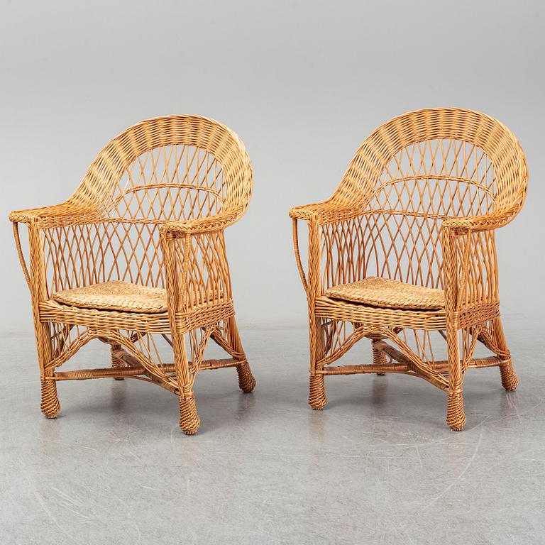 A pair of 1970s/1980s rattan armchairs.