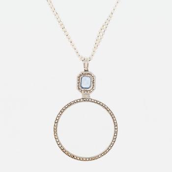 A platinum lorgnette set with a faceted sapphire and rose-cut diamonds.