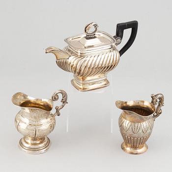 A mixed lot of two 19th century silver and parcel-gilt creamers and a coffee-pot.