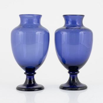 A matched pair of blue glass vases from around the year 1900.