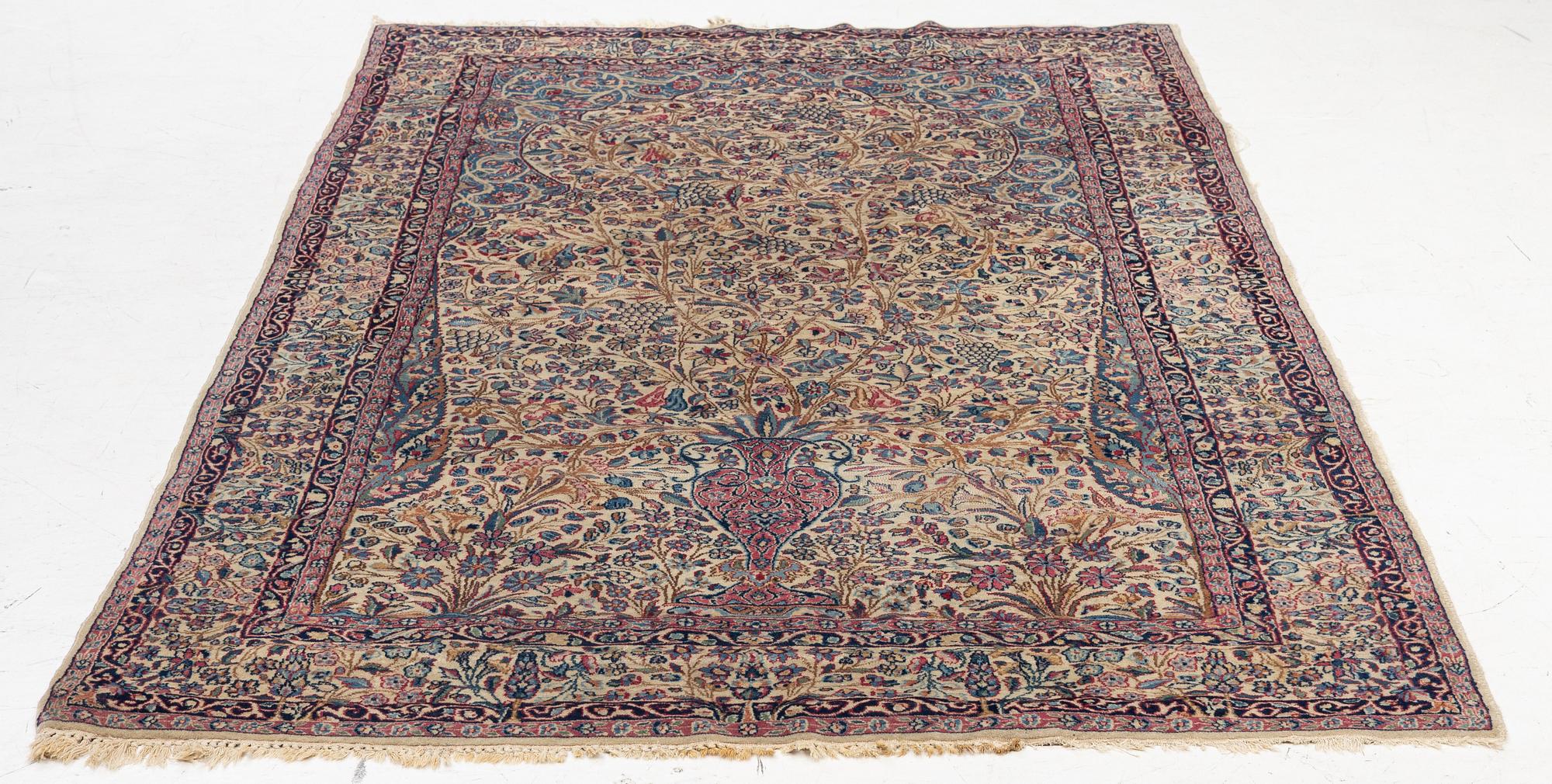 A semi antique Kirman rug, South Persia, c. 228 x 136 cm.