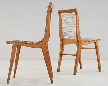 A Louis Sognot set of six ash, metal and rubber chairs, France 1950's.