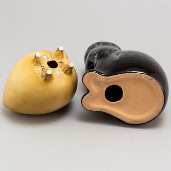 LISA LARSON, two stoneware figurines and a pair of candle holders, from Gustavsberg.